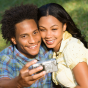 Smiling African American couple taking a selfie. 