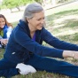Women stretching in a park. 