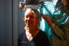 Women’s Health Initiative Clinic Coordinator Theresa Zulawski positions Project Staff Associate Doreen Sheedy for a dental x-ray.