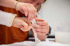 Occupational therapy students participate in a prosthetics and orthotics lab in April 2022 at Kimball Hall. They were tasked with making arm and finger casts. Photographer: Meredith Forrest Kulwicki 