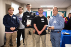 The second-place team, "M.A.I.L. Men," from Amherst Central: (from left) Ian Nettleton, Max Rosen, Aden Clemente and Ian Leising, along with UB biostatistics professor Dietrich Kuhlmann. Photo: Douglas Levere