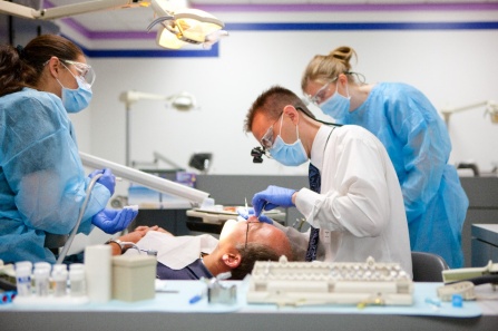Dental professional working with a patient. 
