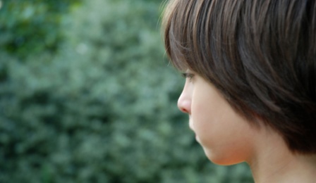 Young child staring in the distance. 