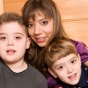 A mother with her two children. 
