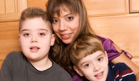 A mother with her two children. 