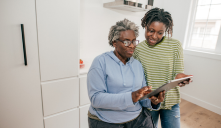 Home caregiver provides assistance to disabled person. 