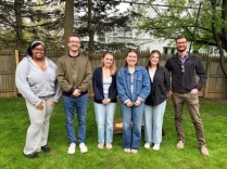 Members of the REAL Lab smile for a photo outside.