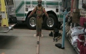 Zoom image: firefighter walking the line