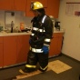 Zoom image: firefighter walking a line
