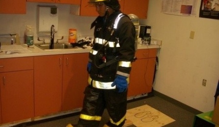 firefighter walking a line. 