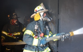firefighter blasting water. 