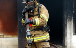 firefighter pulling hose. 
