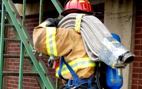 firefighter climbing escape staircase. 