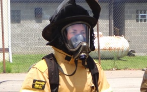 female firefighter in gear. 