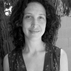 Black and white photo of a woman with dark hair. 