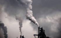 Smoke coming out of factory pipes, polluting their air. 