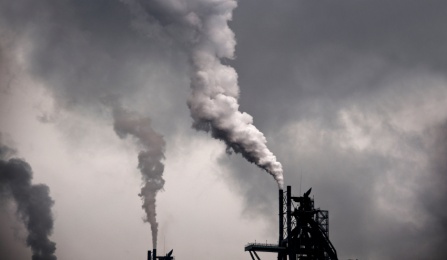 Smoke coming out of factory pipes, polluting their air. 