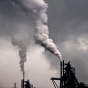 Smoke coming out of factory pipes, polluting their air. 