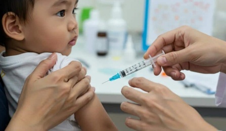 A doctor giving a vaccine to an infant. 