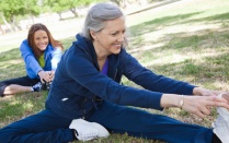 Women stretching in a park. 
