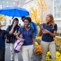 Students walking and talking at South Campus. 