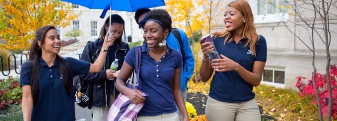 Students walking and talking at South Campus. 