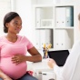 Pregnant woman at the doctors office. 