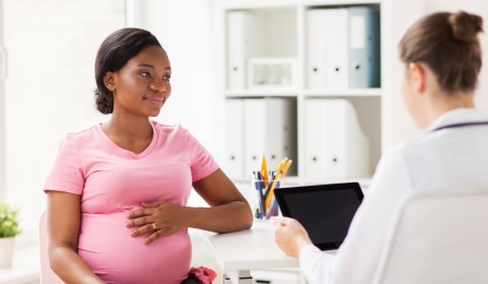 Pregnant woman at the doctors office. 