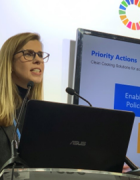 Photo of Heather Adair-Rohani speaking at a podium. 