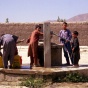 Children collecting water from a well. 