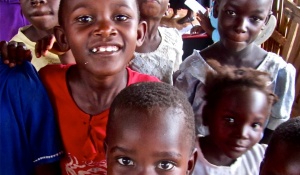 A group of children in Uganda smiling. 