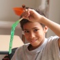 Young boy learning in class. 