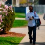 Two students walking on south campus in the spring. 