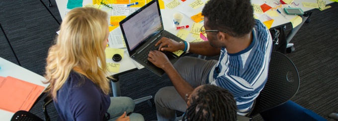 Students collaborating on a project in Hayes Hall during the annual global health challenge. 