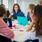 Students working together at the Global Innovation Challenge Communities of Excellence Global Health Equity in Hayes Hall. 