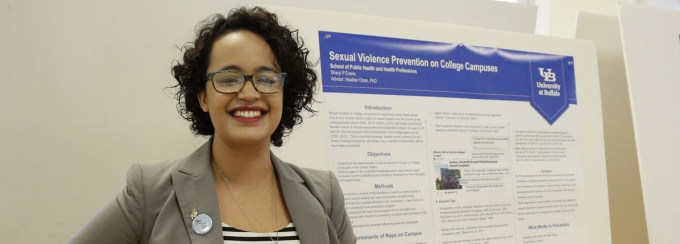 Sharyl Evans, an MPH student in community health and health behavior, presenting her poster at Perry Poster Day. 