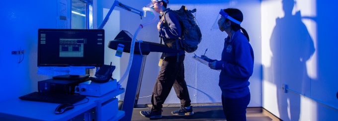 Exercise science major Harrison Courtney uses a treadmill in the center’s environmental chamber, which can simulate hot, cold, humid or dry conditions. 
