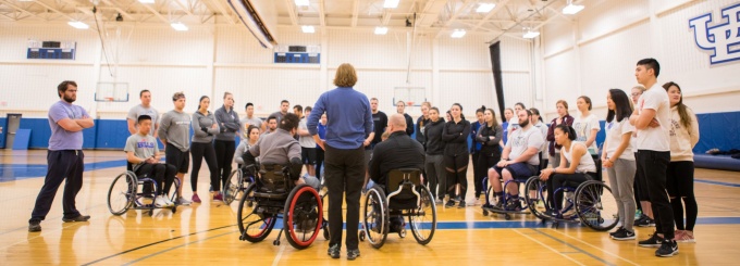 Rehabilitation Science class focused on adaptive sports basketball held in Alumni Arena. 