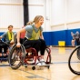 Graduate students participate in a rehabilitation science class focused on adaptive sports, including basketball, tennis, and football, in May 2025 in the Ed Wright Practice gymnasium in Alumni Arena. 