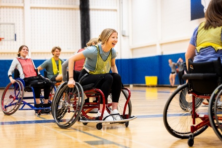 Graduate students participate in a rehabilitation science class focused on adaptive sports, including basketball, tennis, and football, in May 2025 in the Ed Wright Practice gymnasium in Alumni Arena. 