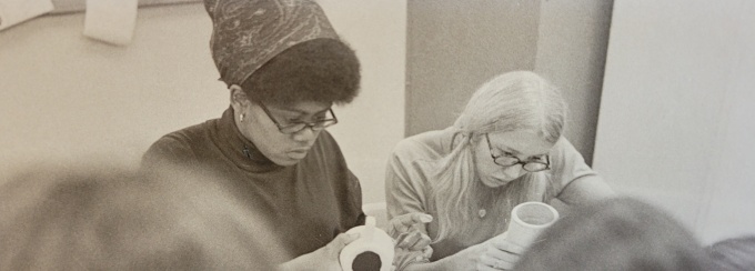 two women work on their clay pots in a 1970s OT lab. 