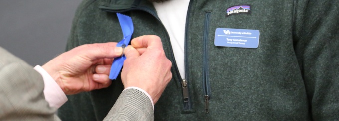 occupational therapy student receives his pin at 2nd annual OT Pin Ceremony. 