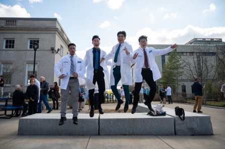 students receiving their white coats. 