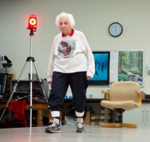 An older woman walking across a lab in a rehabilitation science study. 