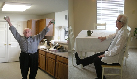 Man standing doing bilateral shoulder abduction with weights. Woman sitting doing knee extensions. 